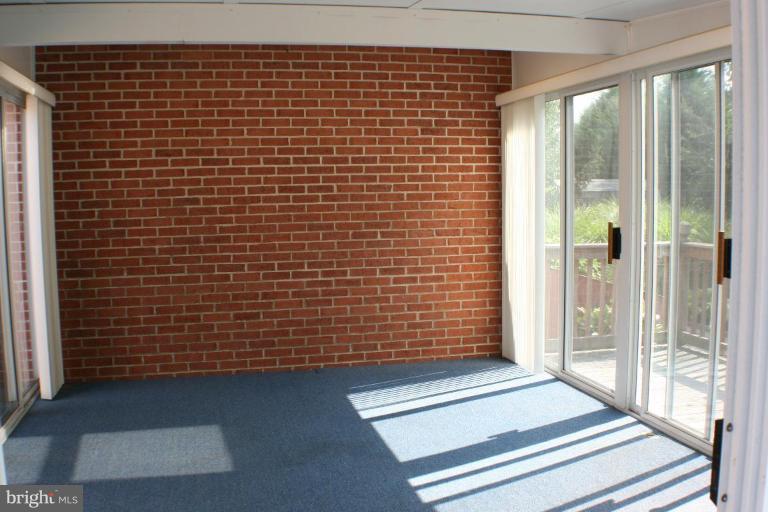 8124 Stone Ridge Drive Frederick, MD 21702 - Photo 15 of 28 a view of a brick wall with windows