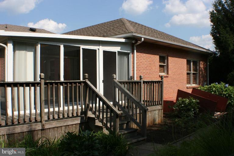 8124 Stone Ridge Drive Frederick, MD 21702 - Photo 16 of 28 a view of a house with wooden deck and furniture