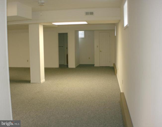 8124 Stone Ridge Drive Frederick, MD 21702 - Photo 17 of 28 a view of a room with a hallway