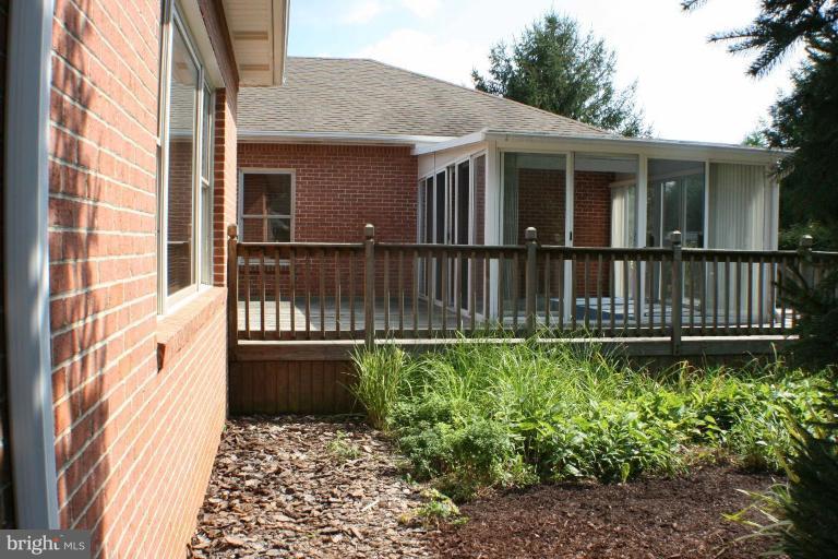 8124 Stone Ridge Drive Frederick, MD 21702 - Photo 19 of 28 a view of a house with backyard and garden