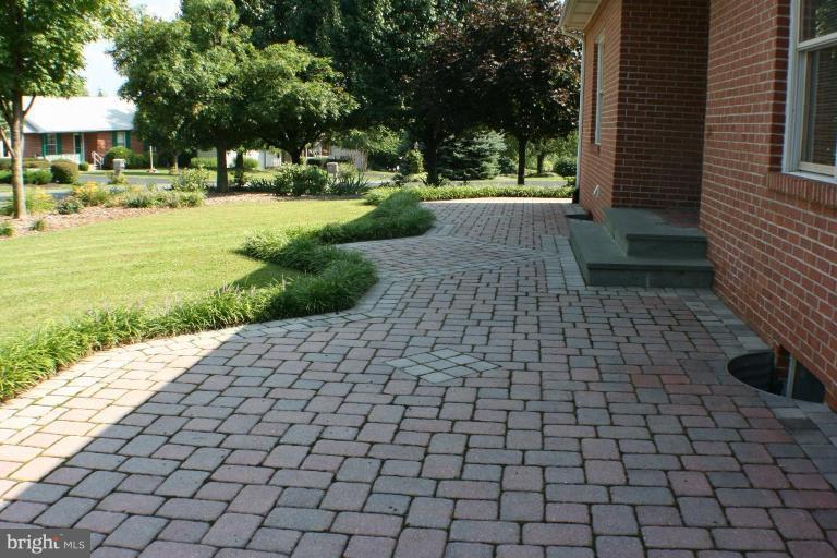 8124 Stone Ridge Drive Frederick, MD 21702 - Photo 23 of 28 a view of a yard with plants and trees