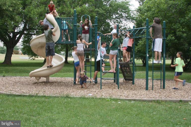 8124 Stone Ridge Drive Frederick, MD 21702 - Photo 28 of 28 a childrens park with lots of swings and slides