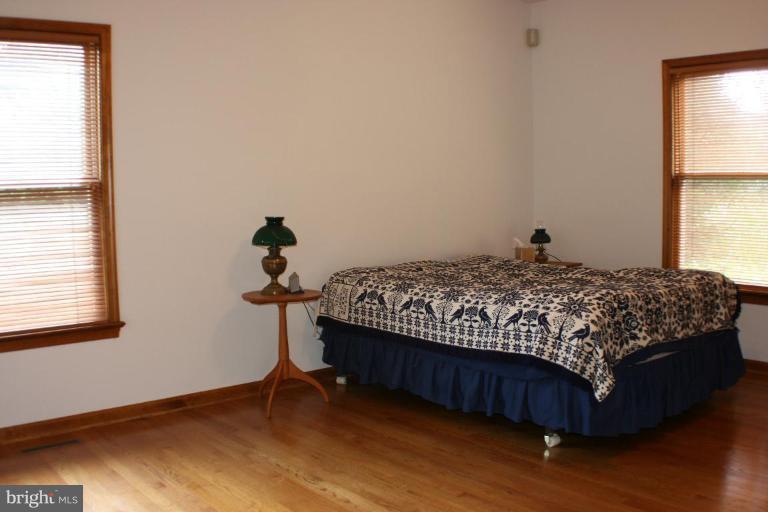 8124 Stone Ridge Drive Frederick, MD 21702 - Photo 10 of 28 a bedroom with a bed and window