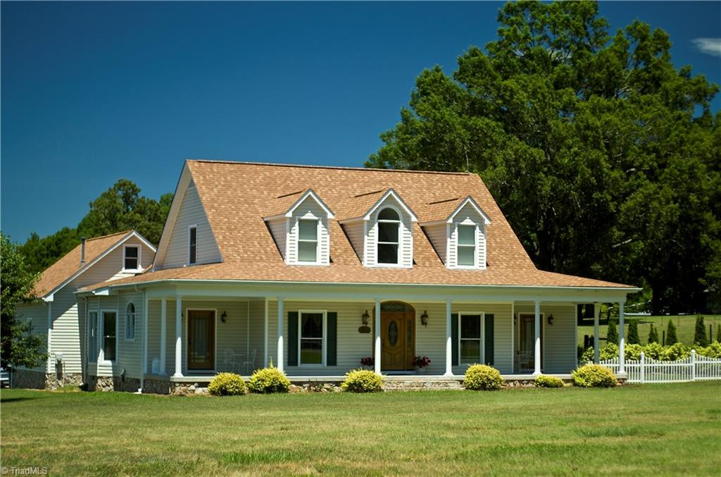 5322 Amick Road Julian, NC 27283 - Photo 1 of 29 Low Maintenance Exterior. Country Rocking Chair Front Porch.