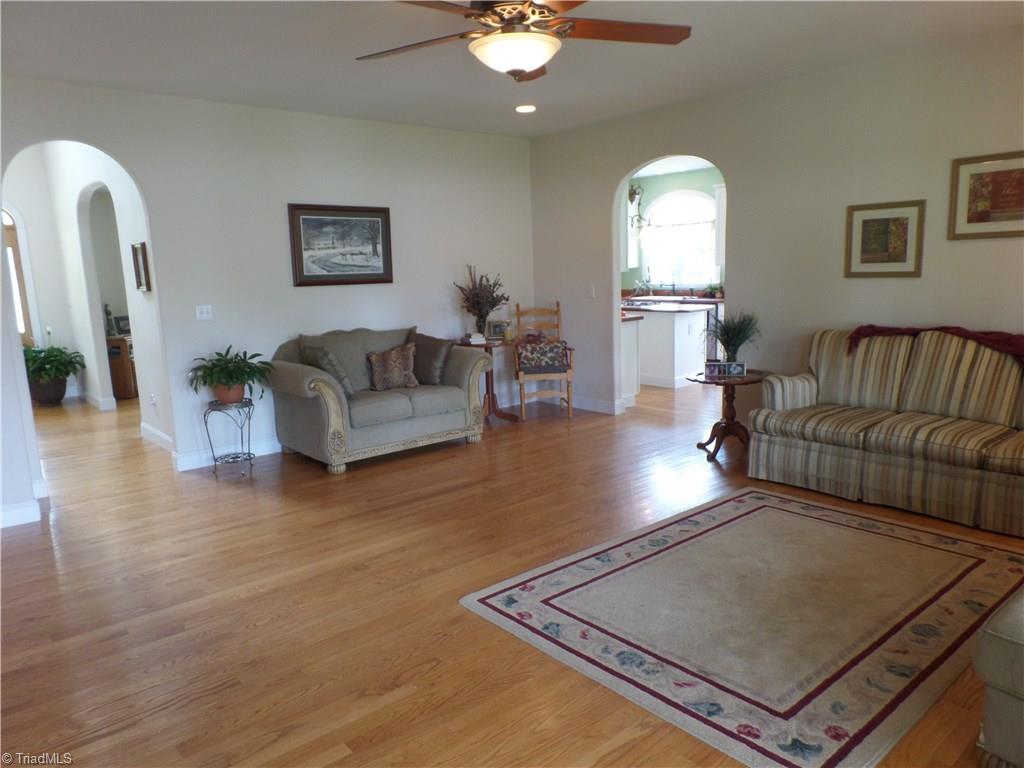 5322 Amick Road Julian, NC 27283 - Photo 7 of 29 Family Room Oak Hardwood. Arced Doorways.