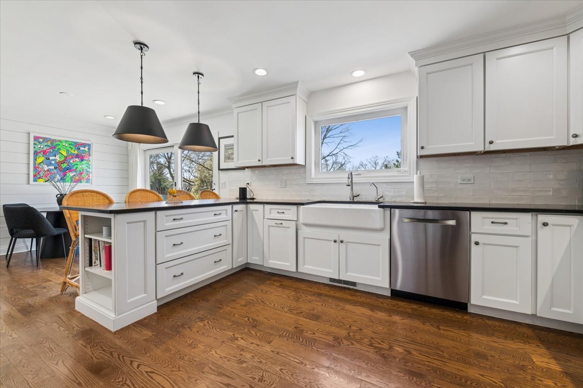 1114 Gamon Road Wheaton, IL 60189 - Photo 21 of 60 a kitchen with stainless steel appliances kitchen island granite countertop a sink a stove and white cabinets