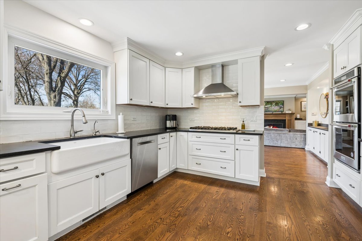 1114 Gamon Road Wheaton, IL 60189 - Photo 22 of 60 a kitchen with granite countertop white cabinets and white stainless steel appliances