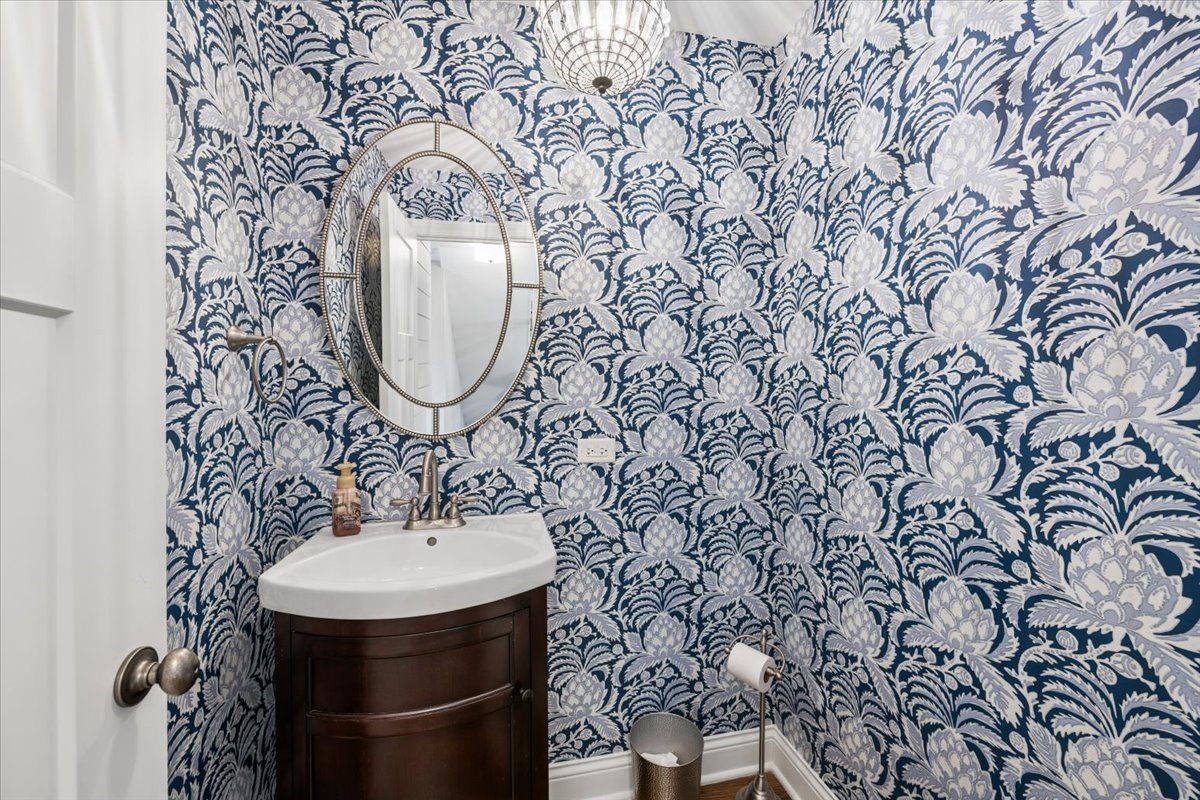 1114 Gamon Road Wheaton, IL 60189 - Photo 30 of 60 a bathroom with a sink and mirror