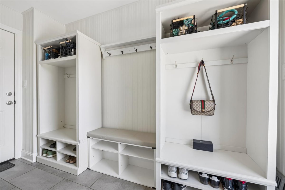 1114 Gamon Road Wheaton, IL 60189 - Photo 33 of 60 a view of walk in closet with clothes and shoes