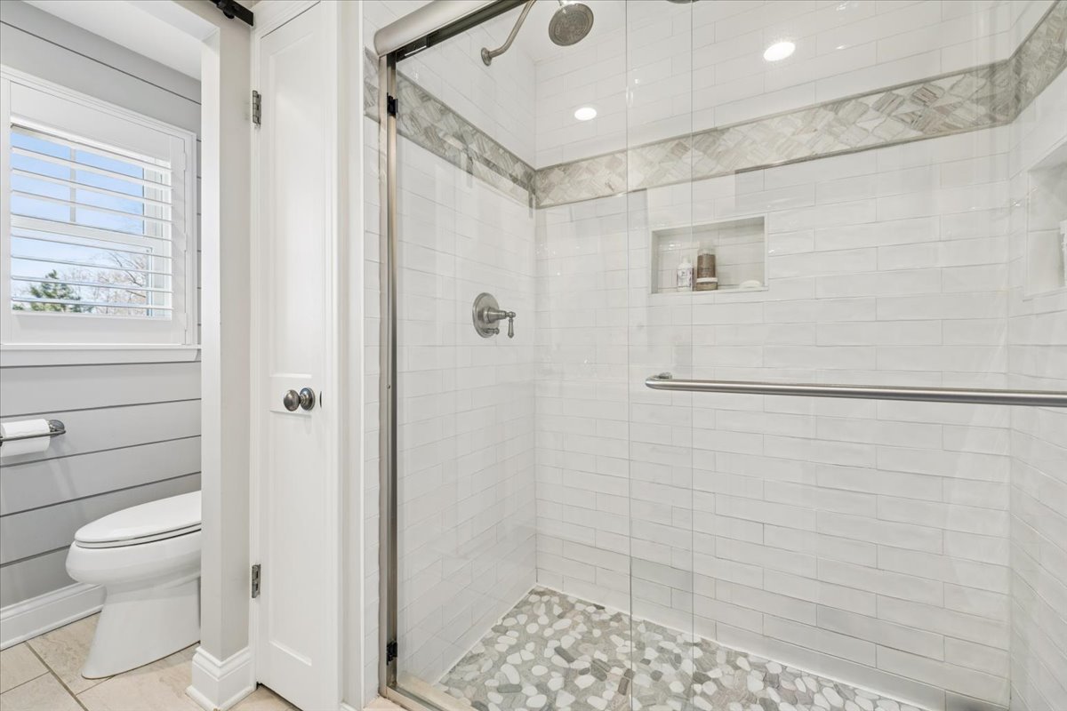 1114 Gamon Road Wheaton, IL 60189 - Photo 37 of 60 a bathroom with a shower a toilet and a window