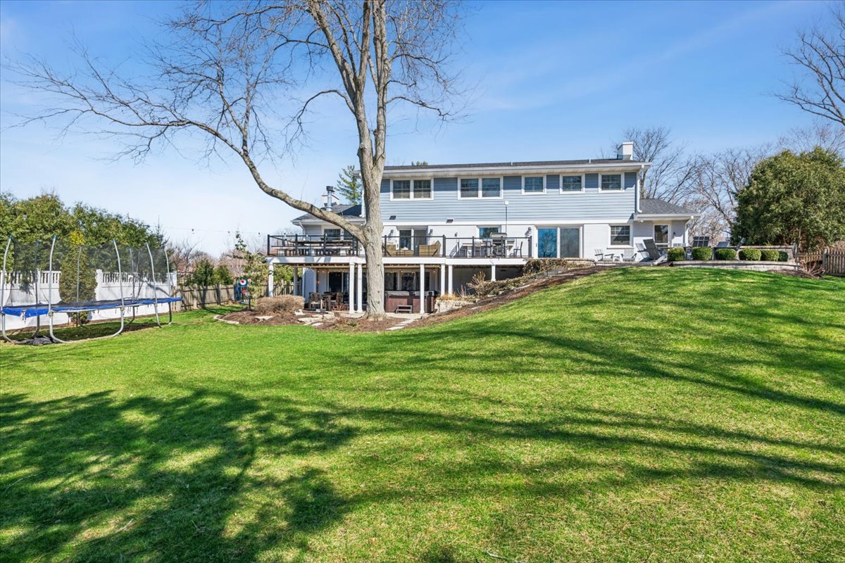 1114 Gamon Road Wheaton, IL 60189 - Photo 4 of 60 a view of a house with a big yard and large trees