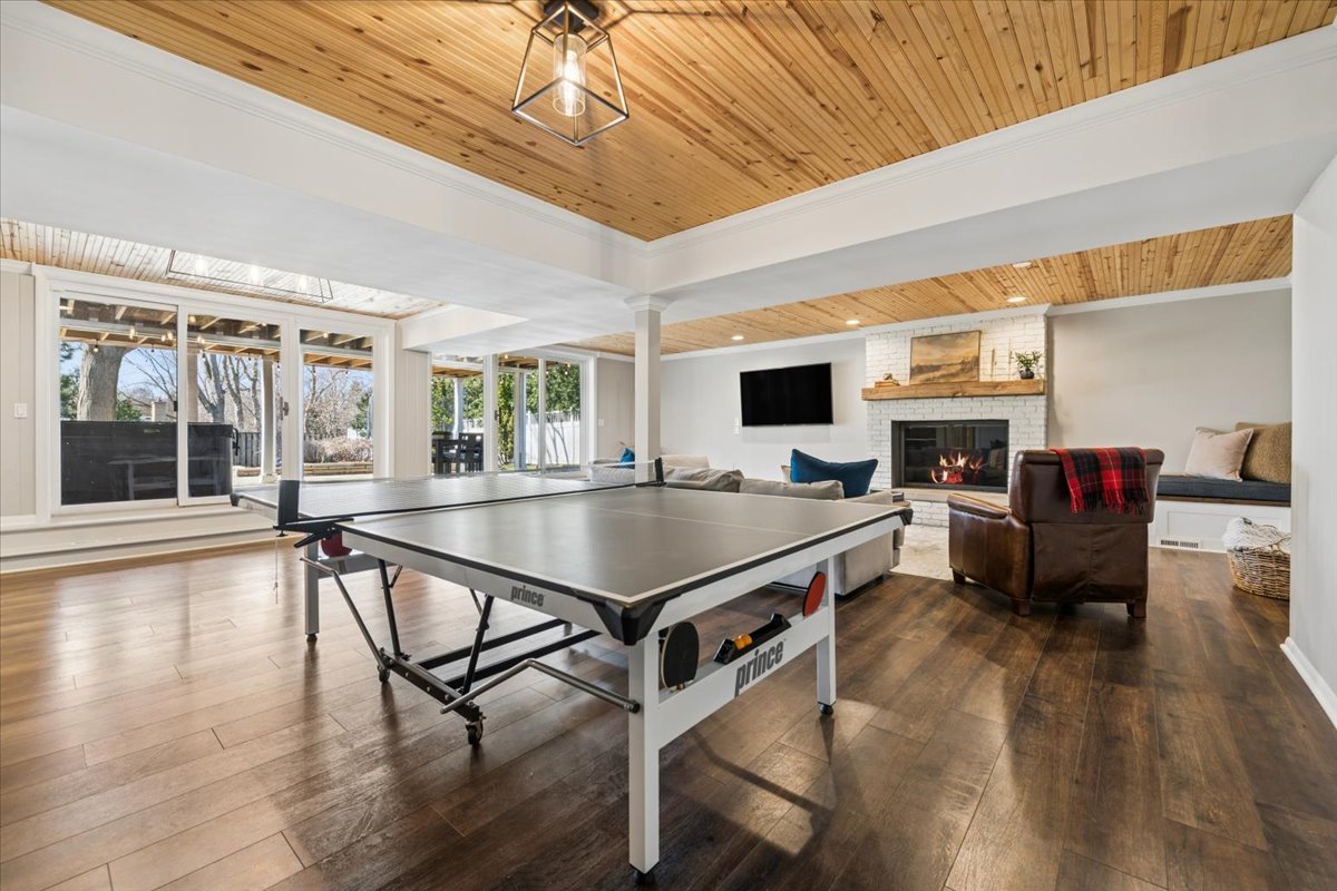 1114 Gamon Road Wheaton, IL 60189 - Photo 49 of 60 a living room with furniture a dining table and wooden floors