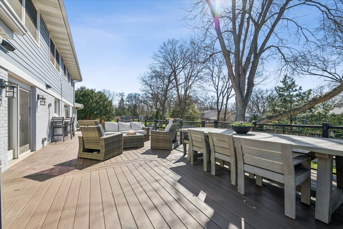 1114 Gamon Road Wheaton, IL 60189 - Photo 5 of 60 a view of a patio with table and chairs and wooden floor