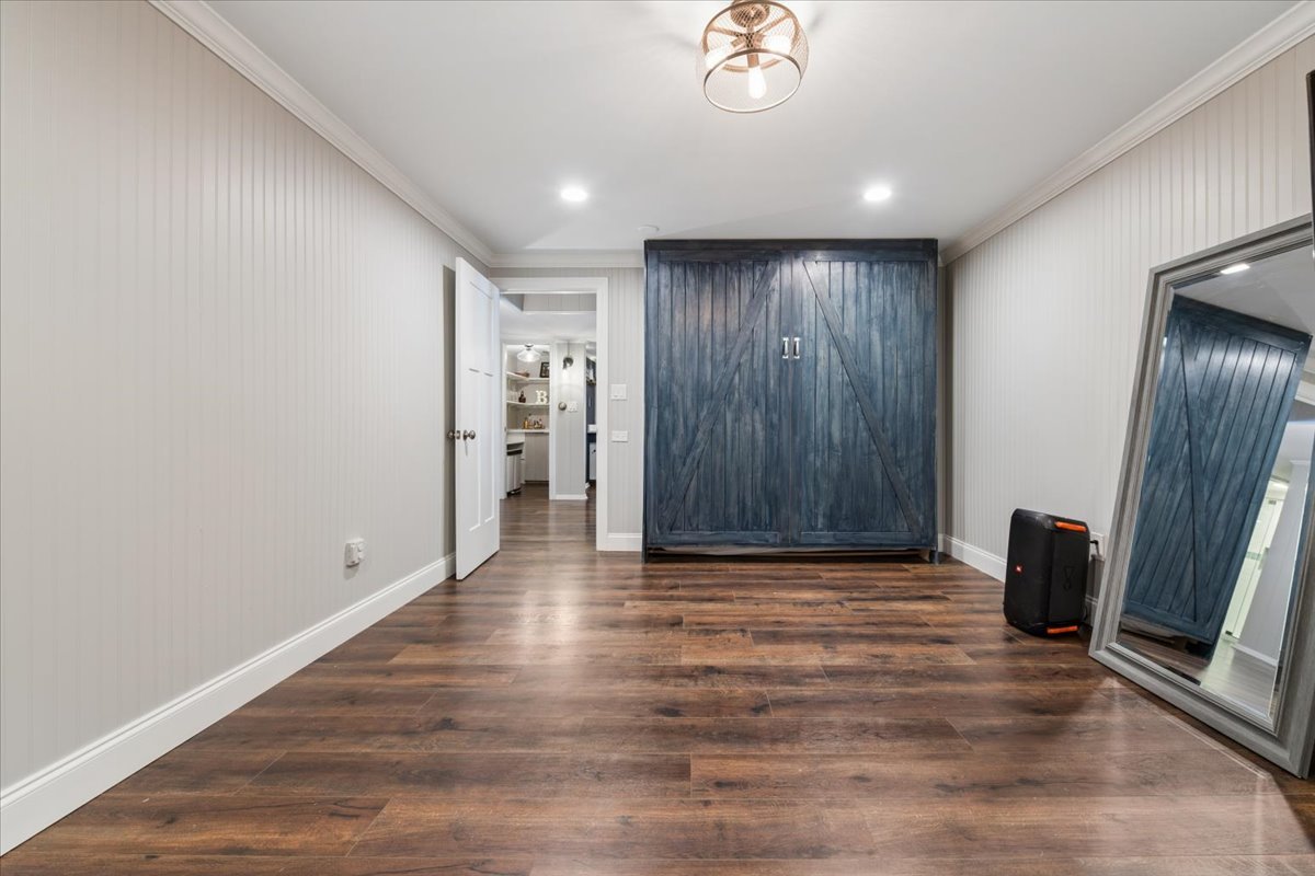 1114 Gamon Road Wheaton, IL 60189 - Photo 55 of 60 a view of an empty room with wooden floor and a window