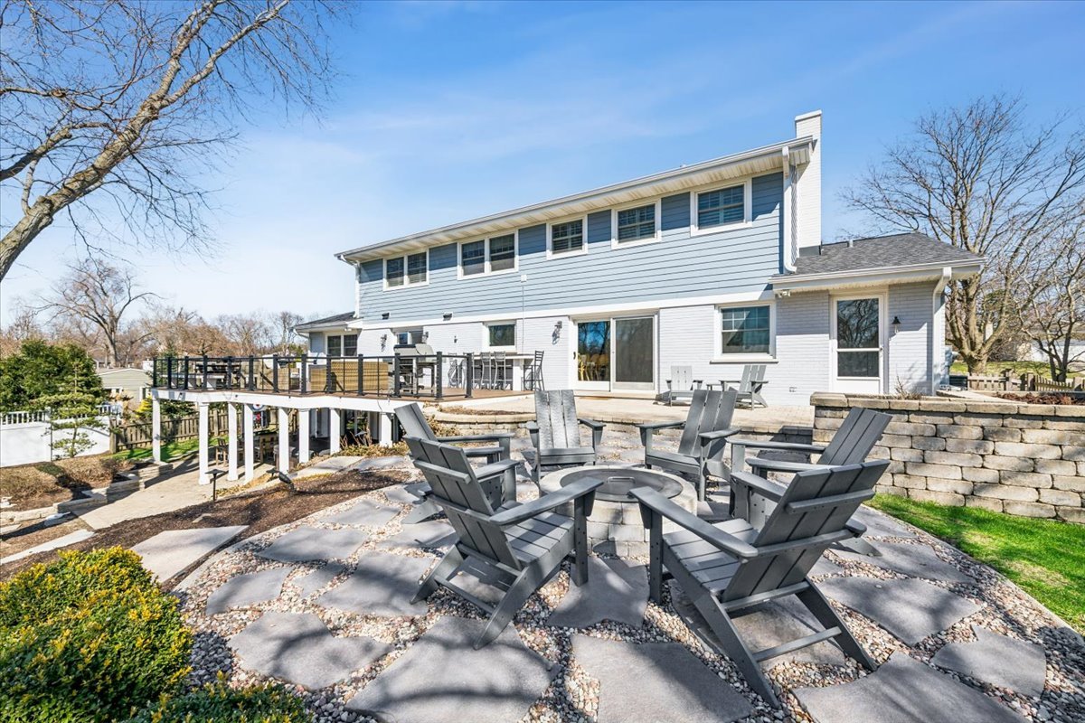 1114 Gamon Road Wheaton, IL 60189 - Photo 9 of 60 a view of a patio with table and chairs with wooden floor and fence
