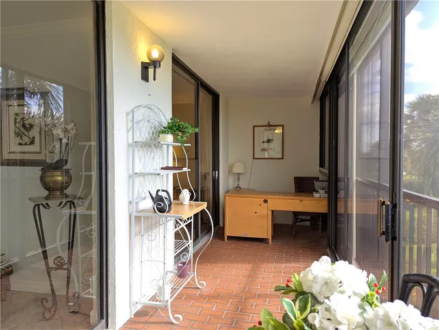 a view of a livingroom with furniture and bedroom view