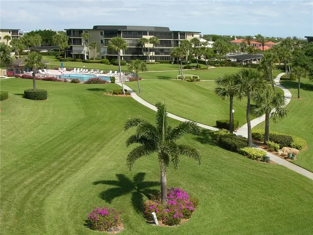 a view of a lake with a building in the background