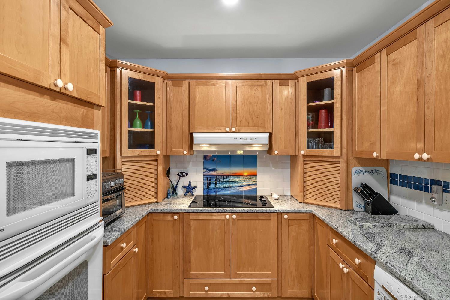 33 Fenwood Road Old Saybrook, CT 06475 - Photo 13 of 37 a kitchen with stainless steel appliances granite countertop a stove and a sink