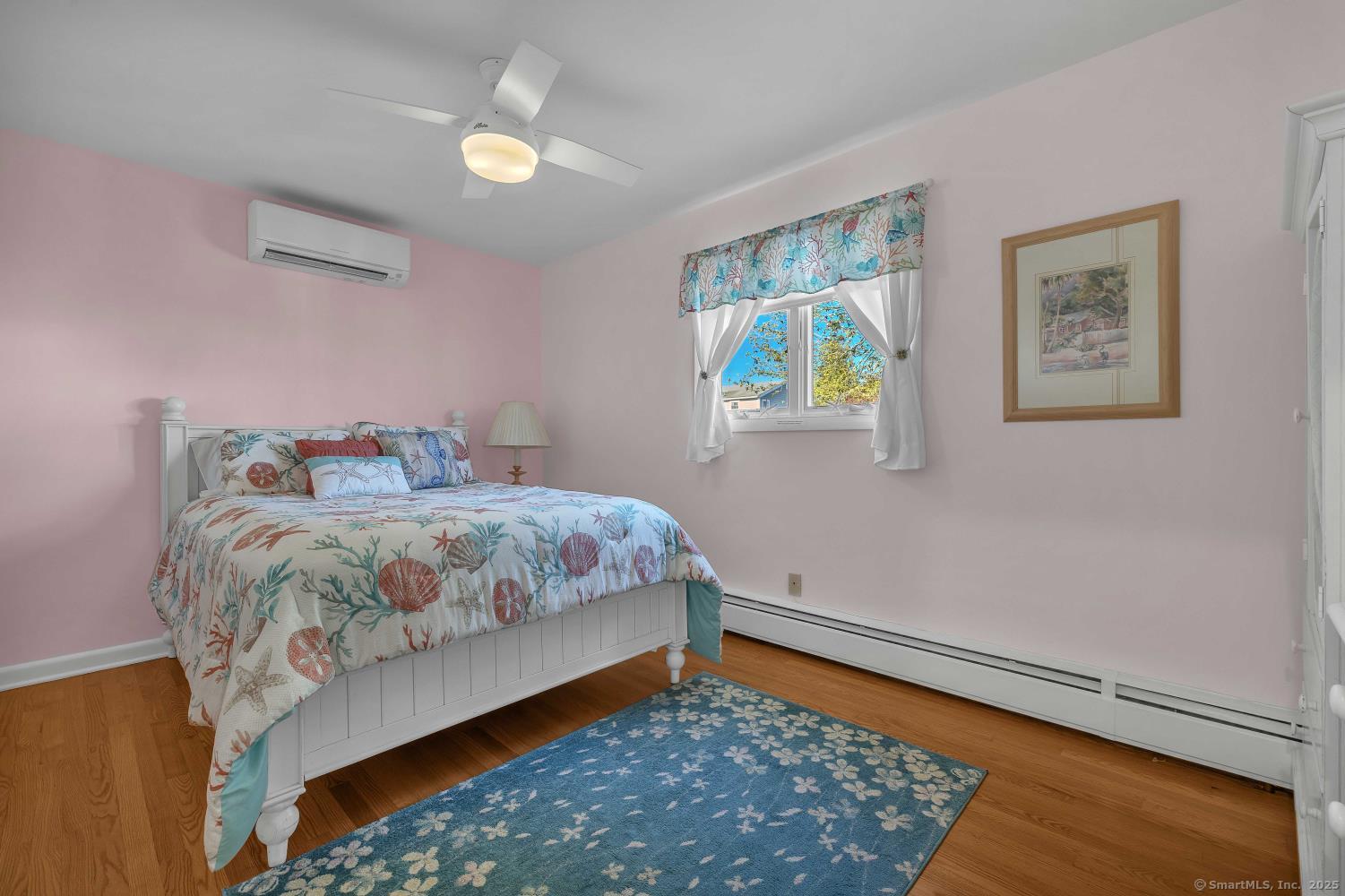33 Fenwood Road Old Saybrook, CT 06475 - Photo 17 of 37 a bedroom with a bed and a painting on the wall