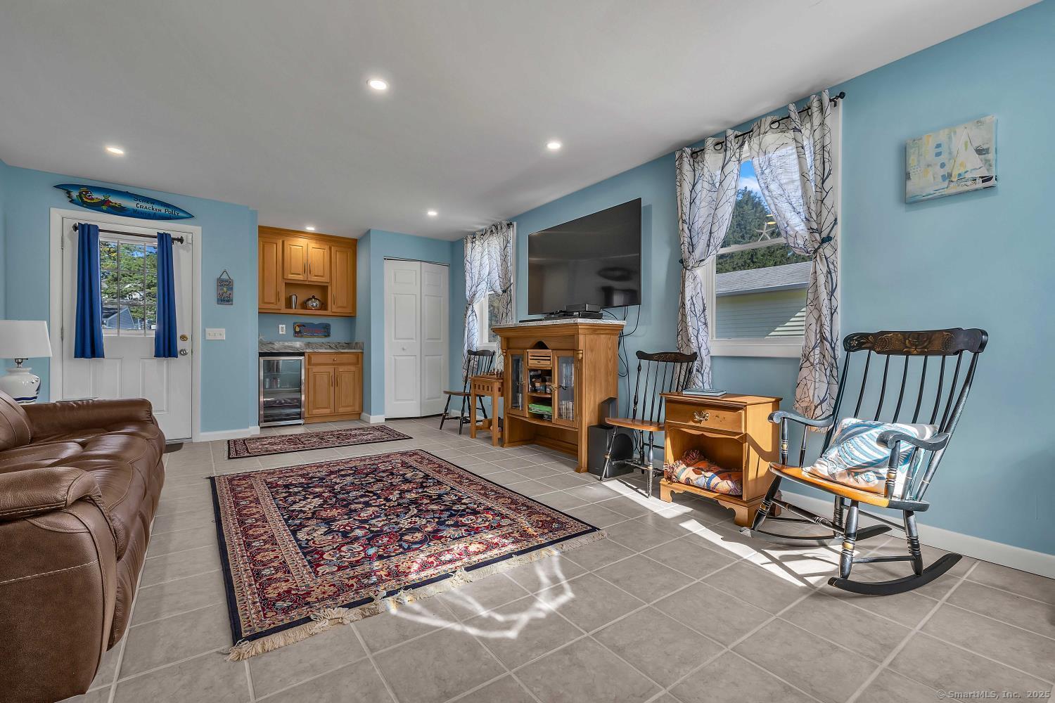 33 Fenwood Road Old Saybrook, CT 06475 - Photo 5 of 37 a living room with furniture and a flat screen tv