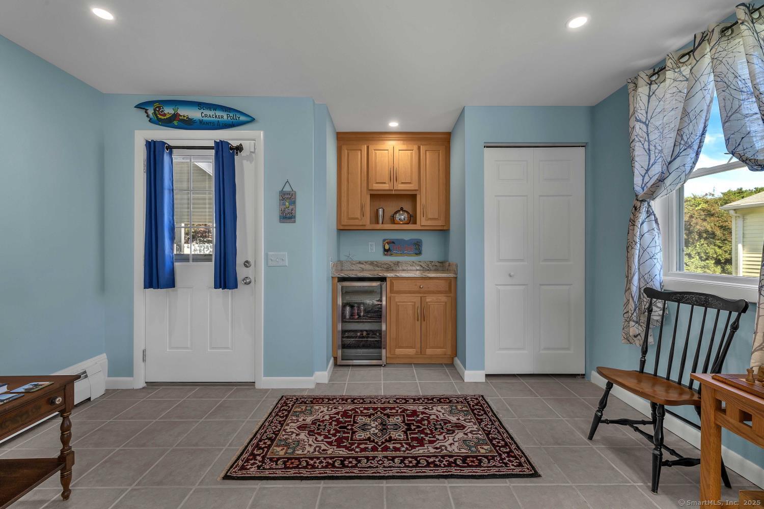 33 Fenwood Road Old Saybrook, CT 06475 - Photo 6 of 37 a view of a hallway to a livingroom with furniture and window