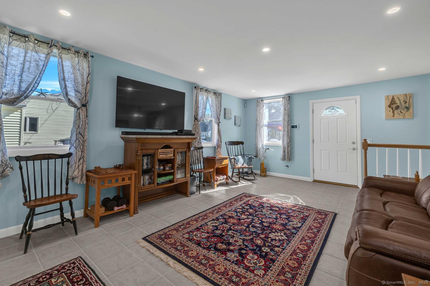 33 Fenwood Road Old Saybrook, CT 06475 - Photo 7 of 37 a living room with furniture and a flat screen tv