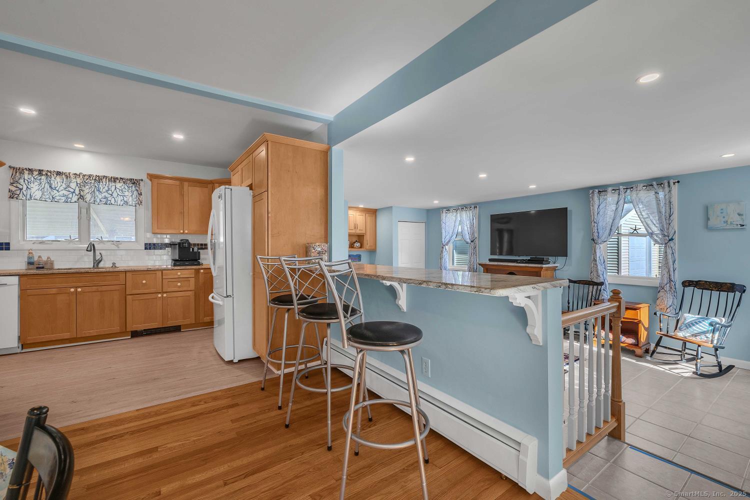 33 Fenwood Road Old Saybrook, CT 06475 - Photo 9 of 37 a living room with stainless steel appliances furniture a flat screen tv and kitchen view