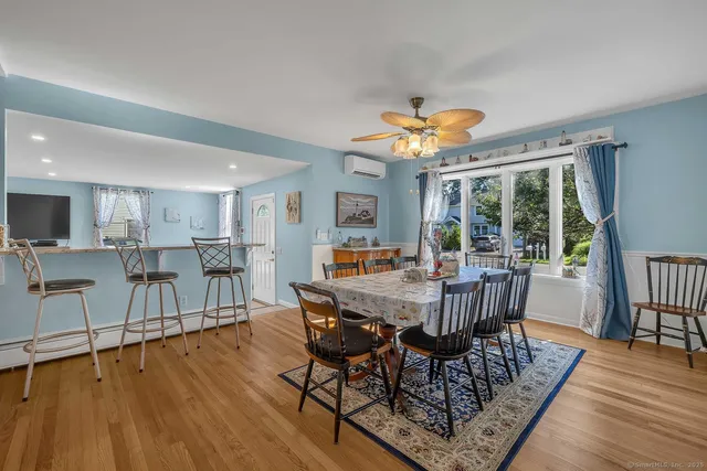 a view of a dining room with furniture window and wooden floor