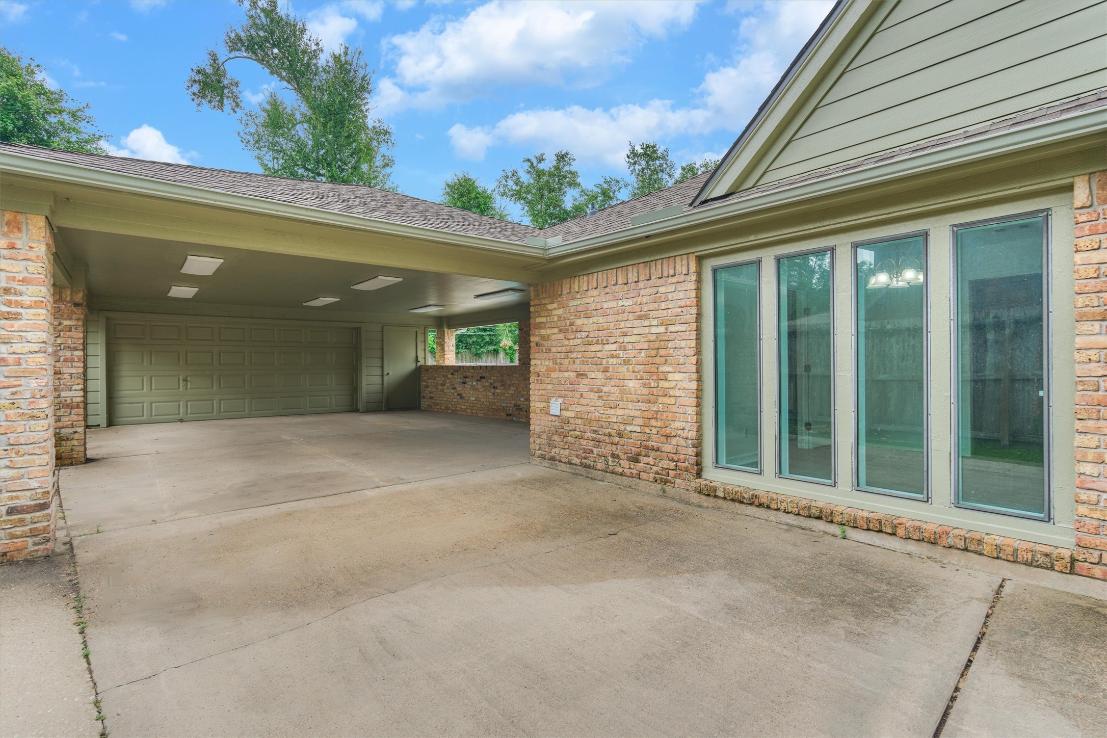 19426 Whitewood Drive Spring, TX 77373 - Photo 32 of 41 Gated Driveway, Garage and Carport entrance.