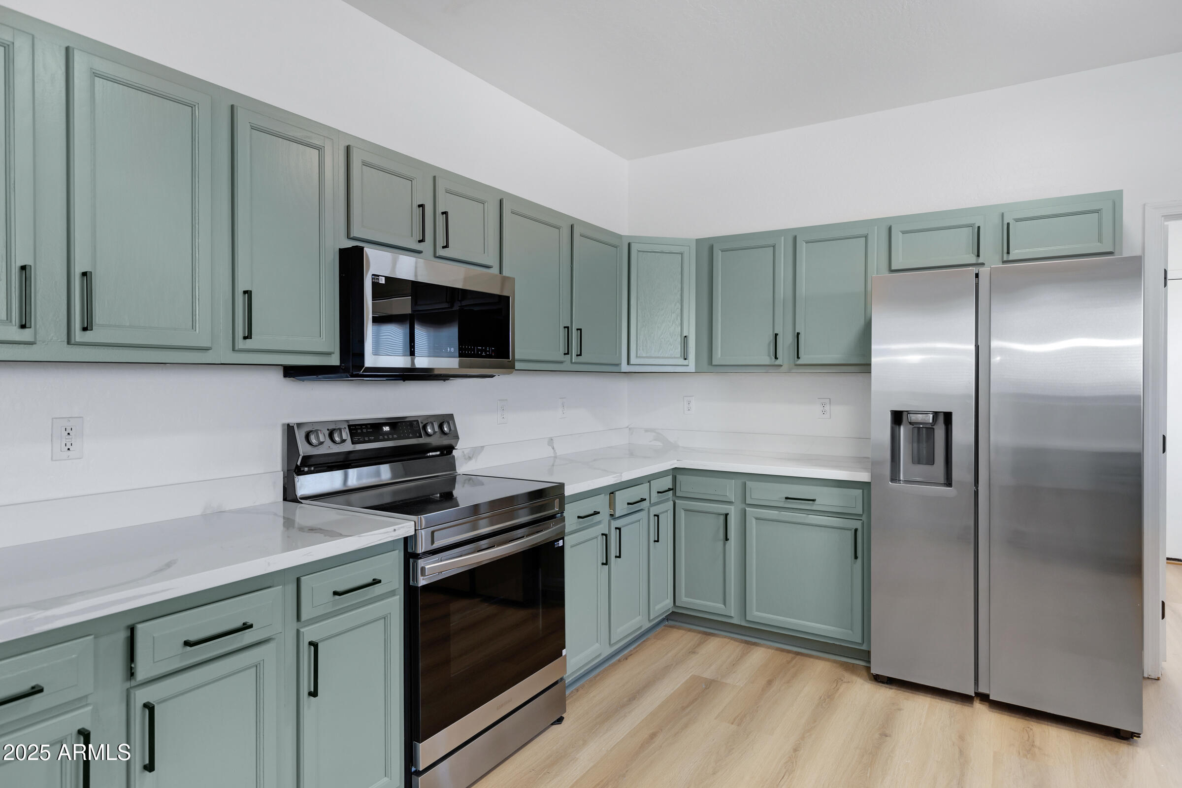 34247 West Pecan Road Tonopah, AZ 85354 - Photo 13 of 31 a kitchen with cabinets stainless steel appliances and a sink