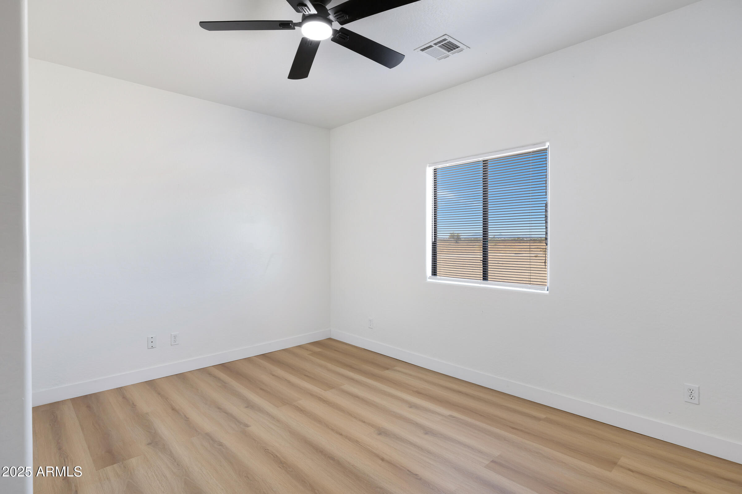 34247 West Pecan Road Tonopah, AZ 85354 - Photo 19 of 31 an empty room with a window and a fan