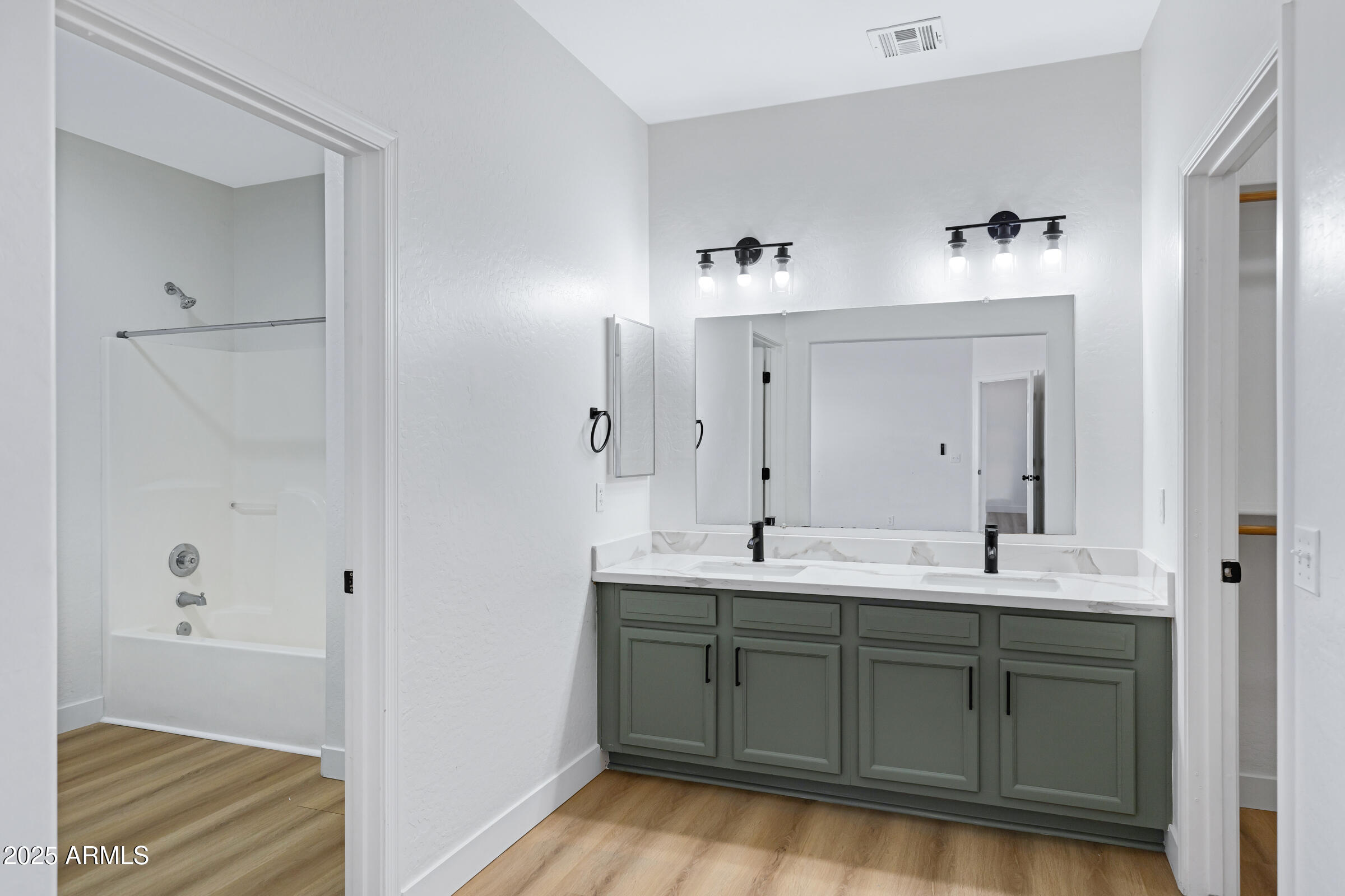 34247 West Pecan Road Tonopah, AZ 85354 - Photo 23 of 31 a en suite bathroom with double sink and mirror