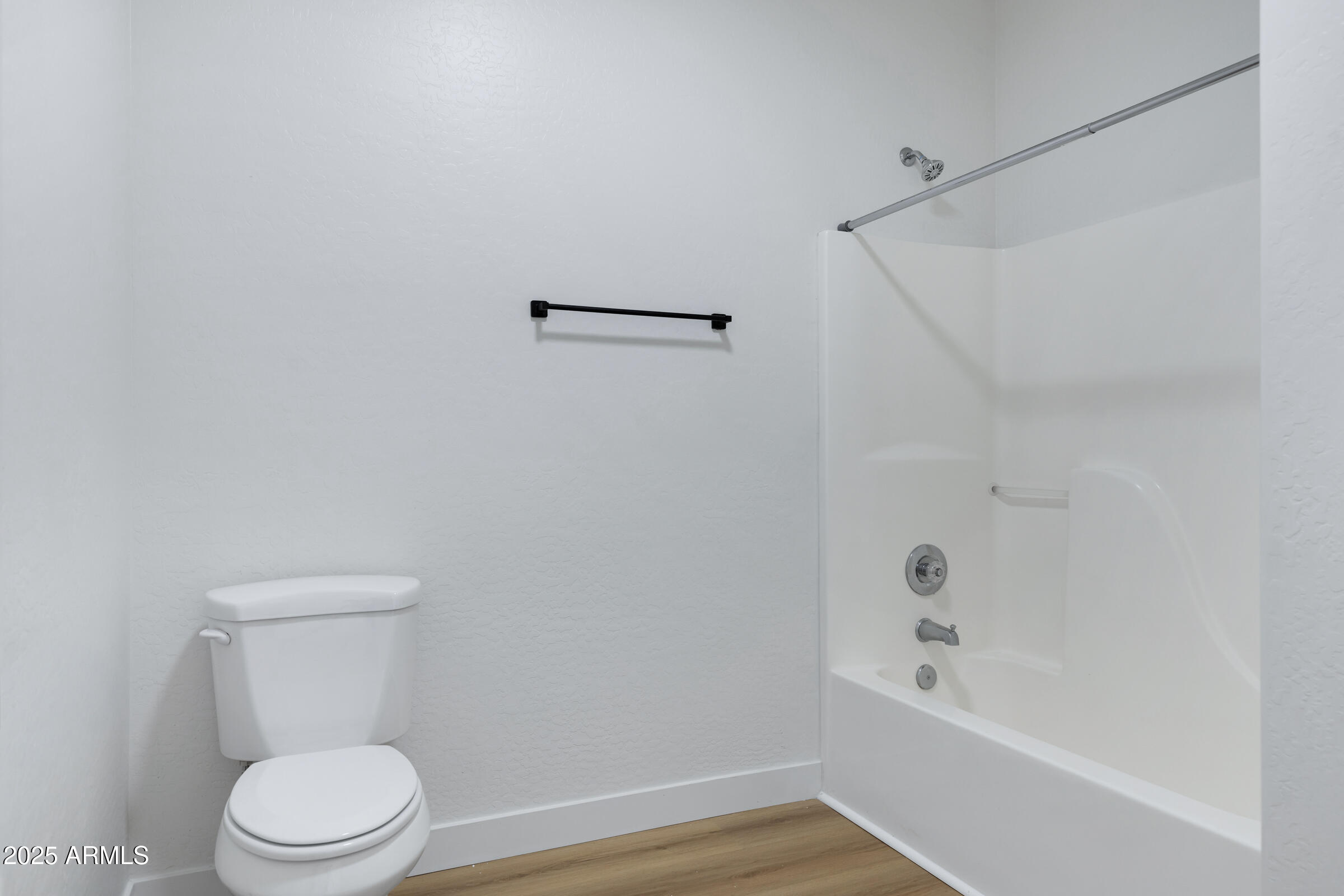 34247 West Pecan Road Tonopah, AZ 85354 - Photo 24 of 31 a white toilet sitting next to a bath tub