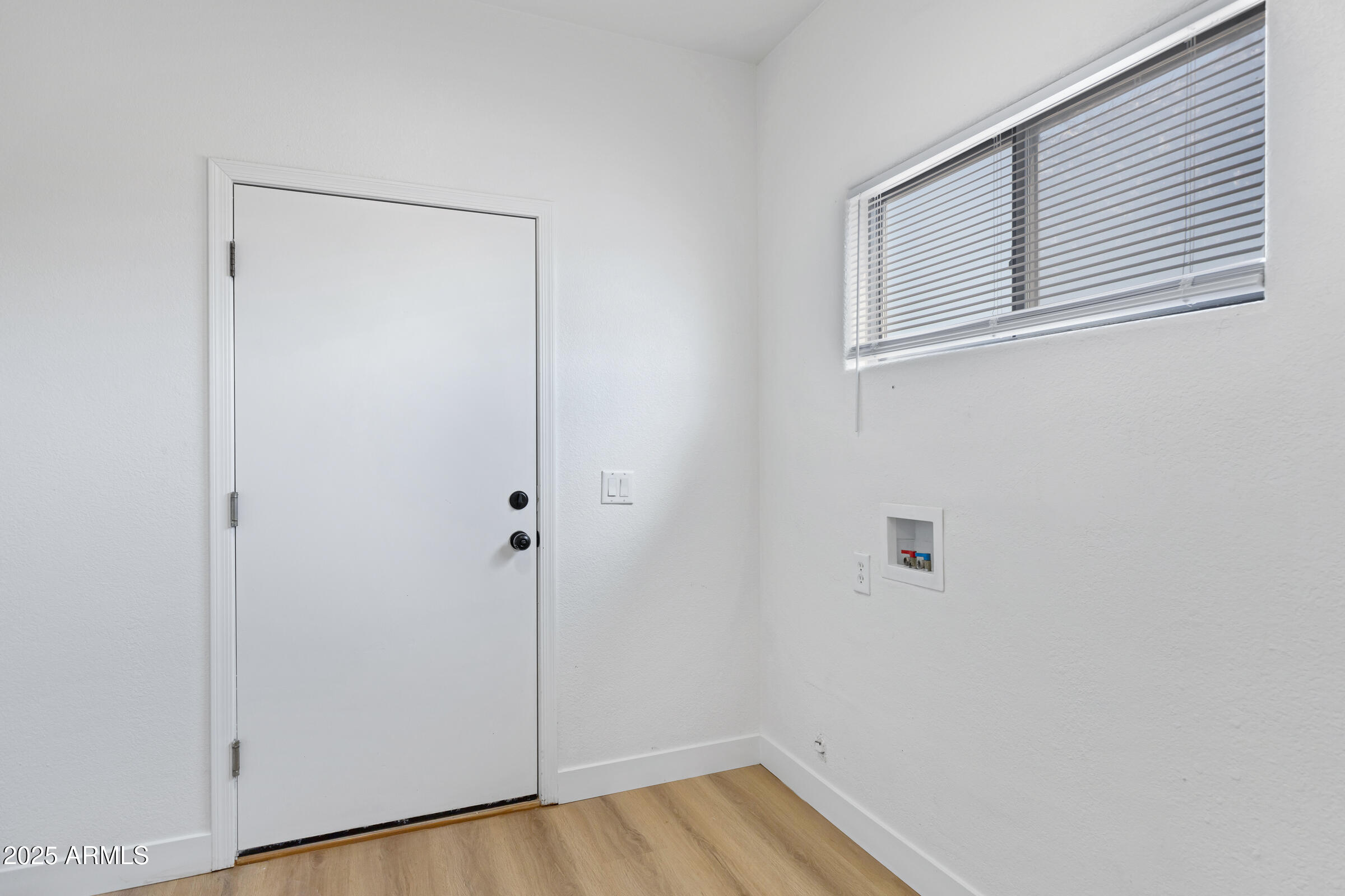 34247 West Pecan Road Tonopah, AZ 85354 - Photo 26 of 31 a view of an empty room with wooden floor and closet