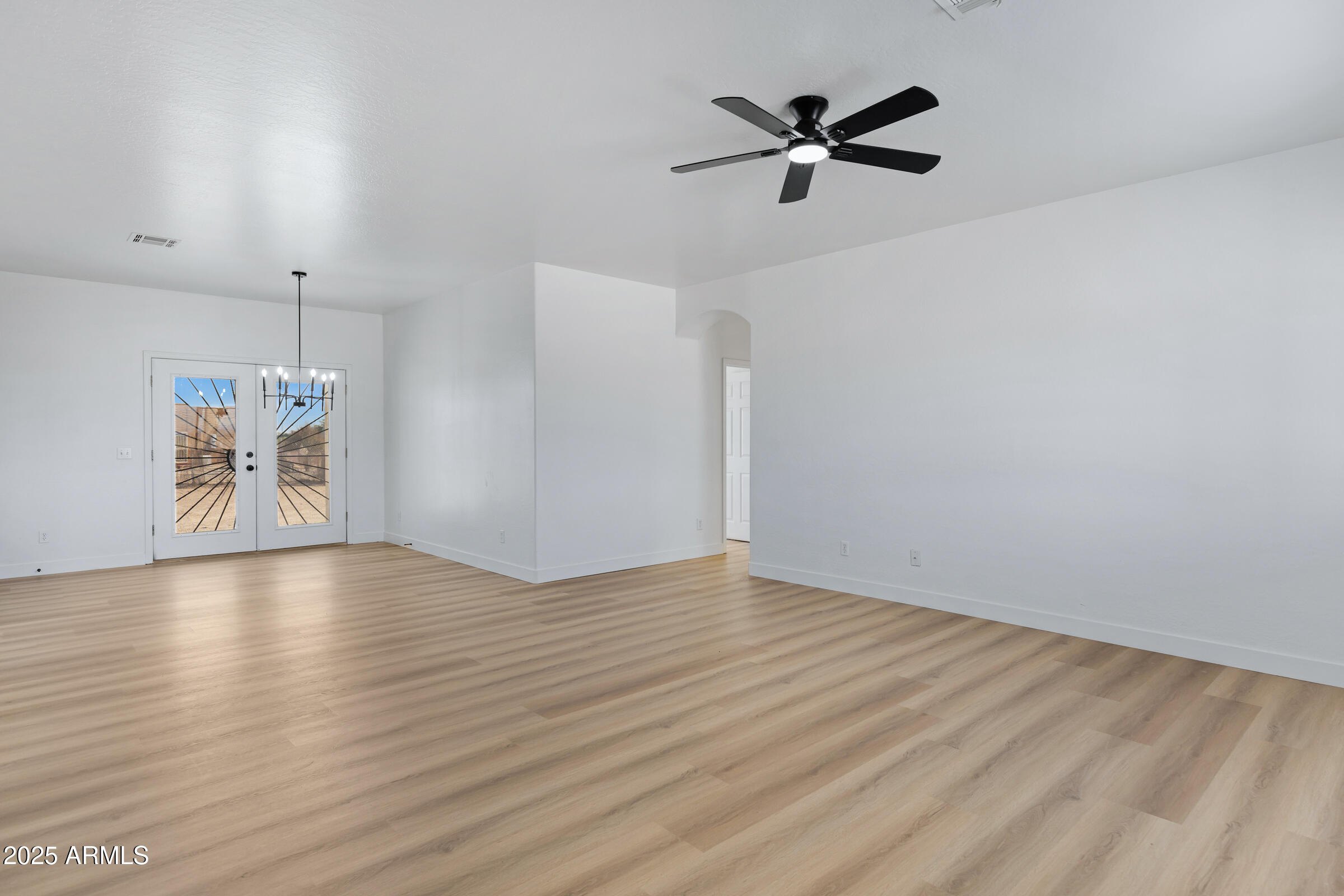 34247 West Pecan Road Tonopah, AZ 85354 - Photo 6 of 31 wooden floor in an empty room with a window