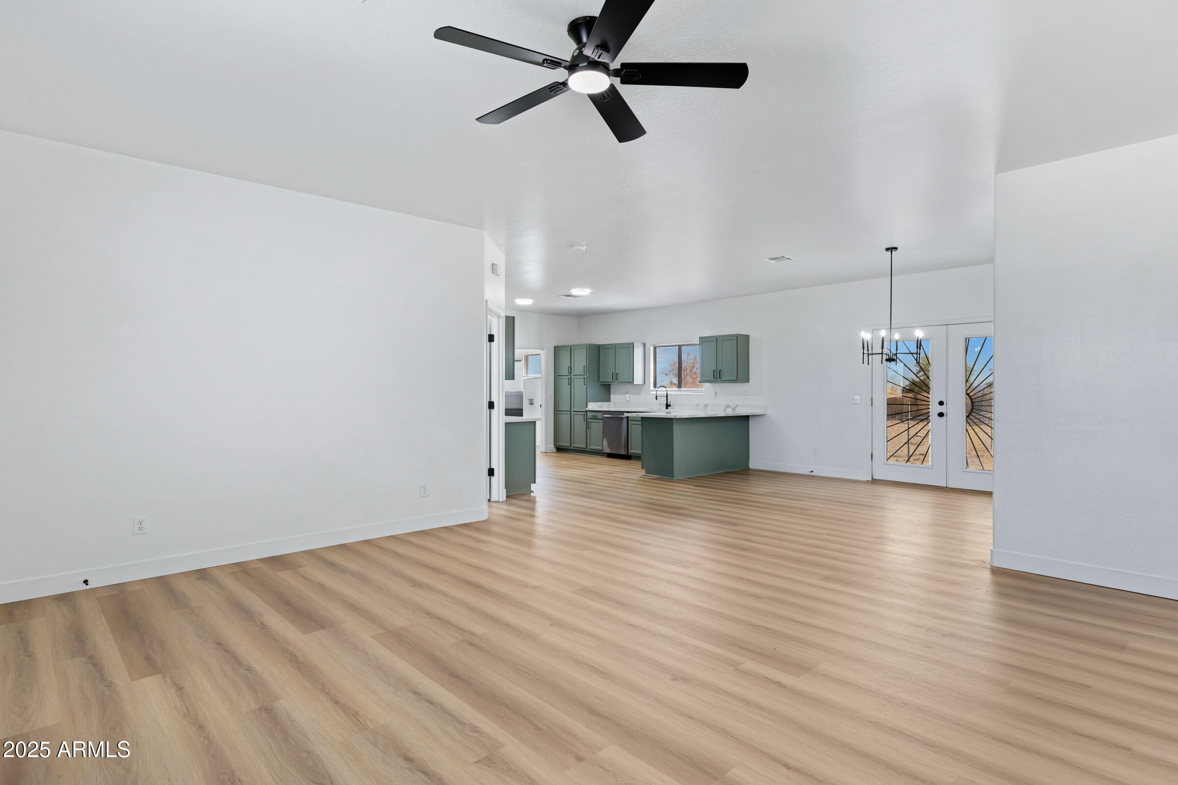 34247 West Pecan Road Tonopah, AZ 85354 - Photo 8 of 31 a view of empty room with wooden floor