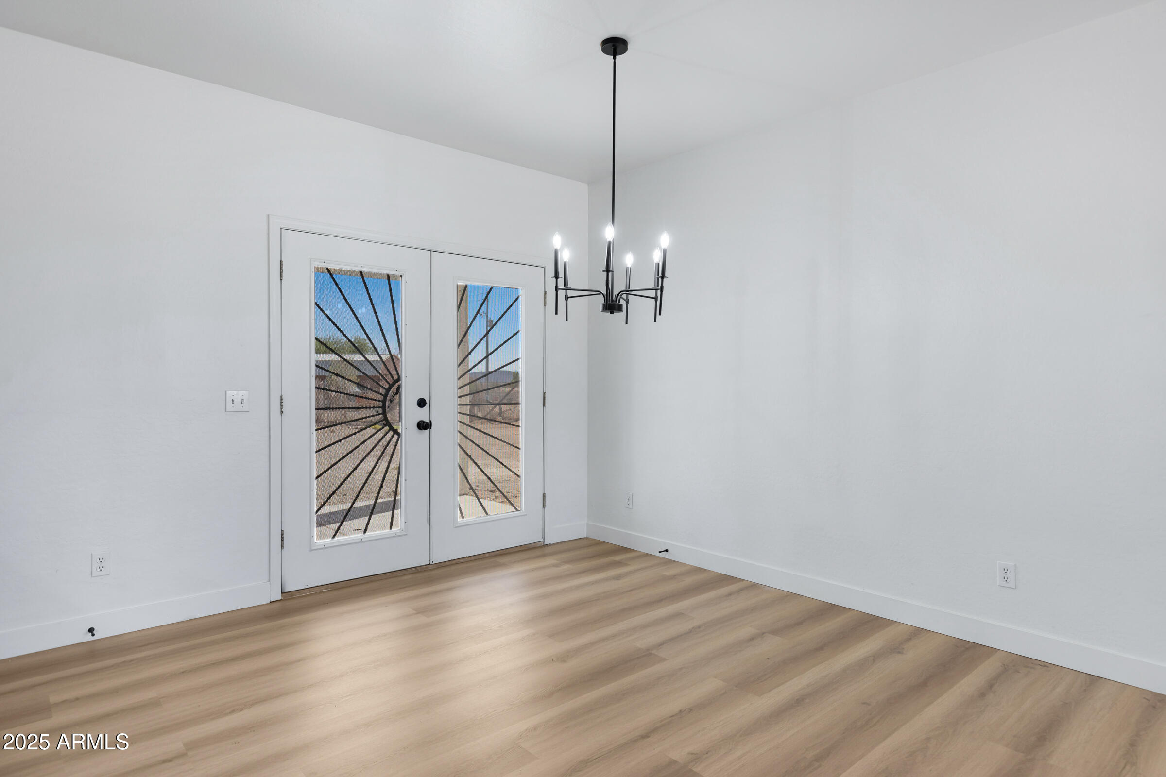 34247 West Pecan Road Tonopah, AZ 85354 - Photo 10 of 31 a view of a chandelier and closet in a room