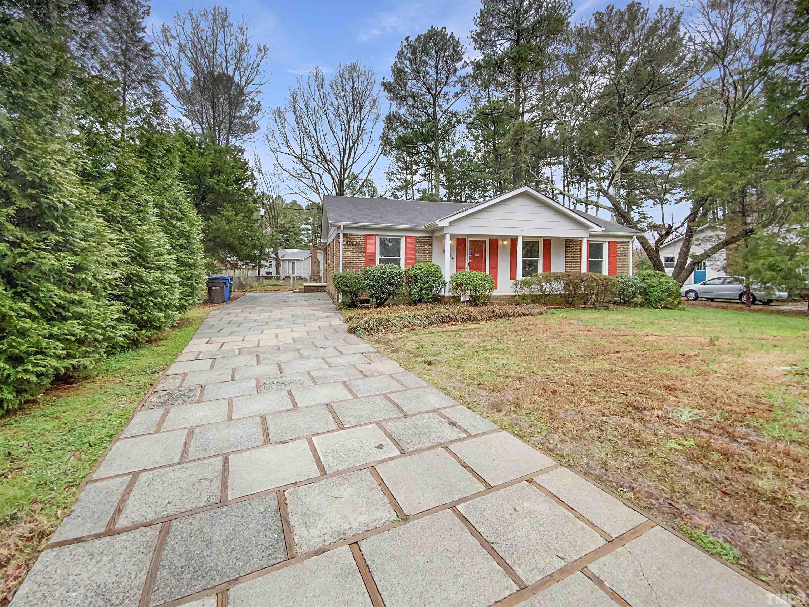 1344 Sedwick Road Durham, NC 27713 - Photo 1 of 16 a front view of a house with a yard