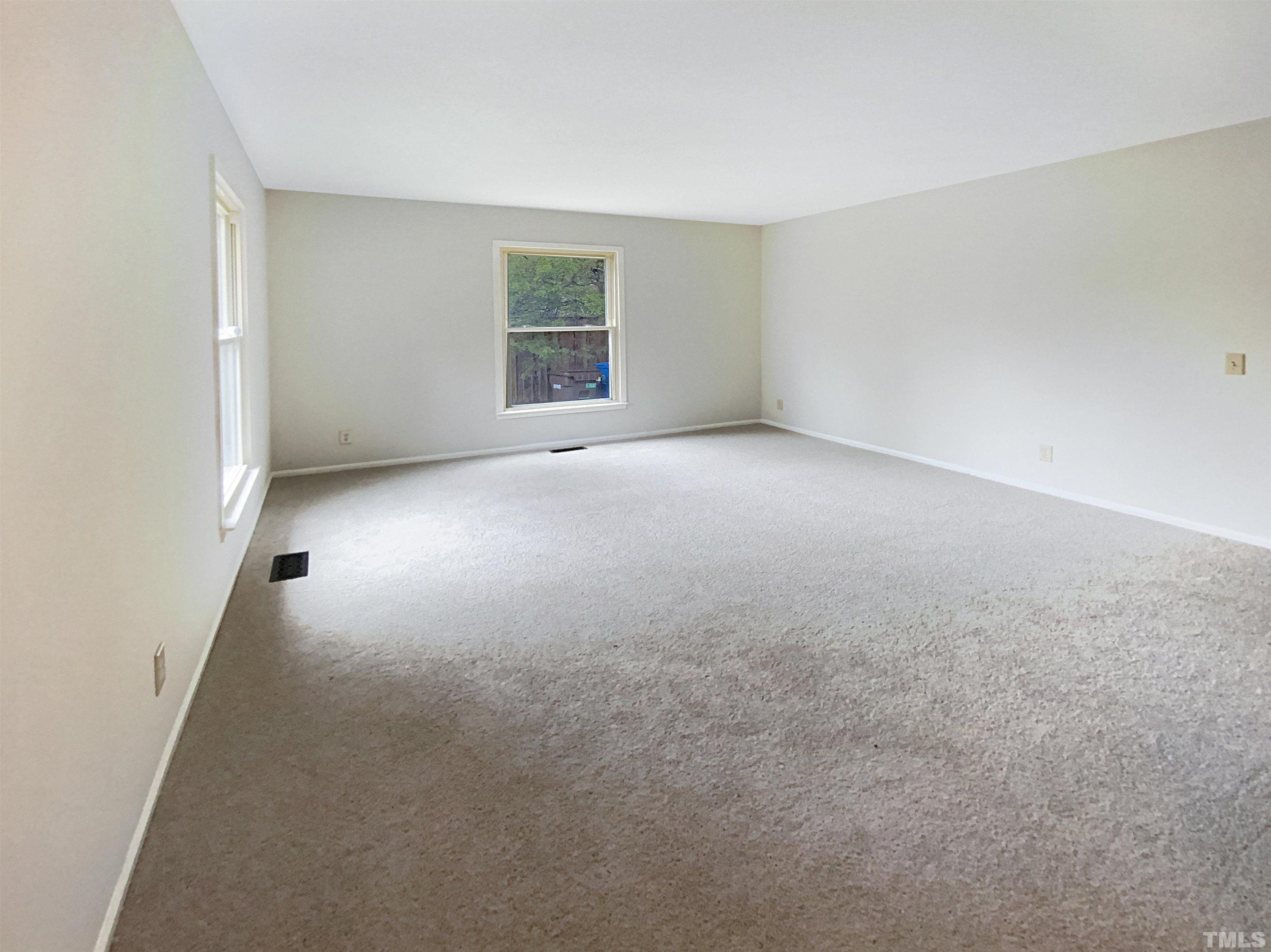 1344 Sedwick Road Durham, NC 27713 - Photo 6 of 16 an empty room with windows