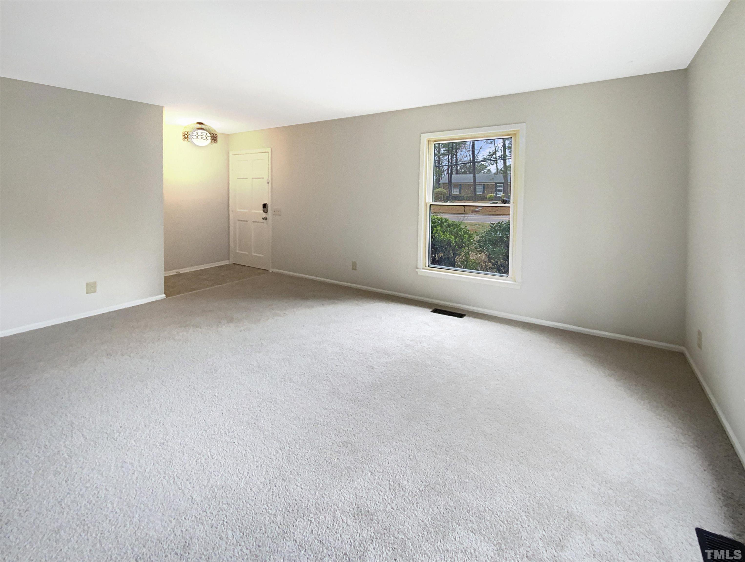 1344 Sedwick Road Durham, NC 27713 - Photo 7 of 16 an empty room with windows