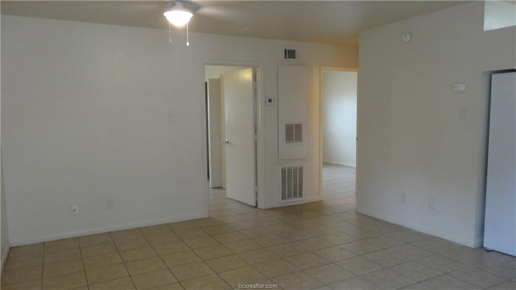 510 Avondale Avenue, Unit 14 Bryan, TX 77802 - Photo 4 of 13 an empty room with a bathroom
