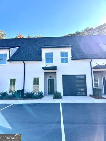 a front view of a house with a garage
