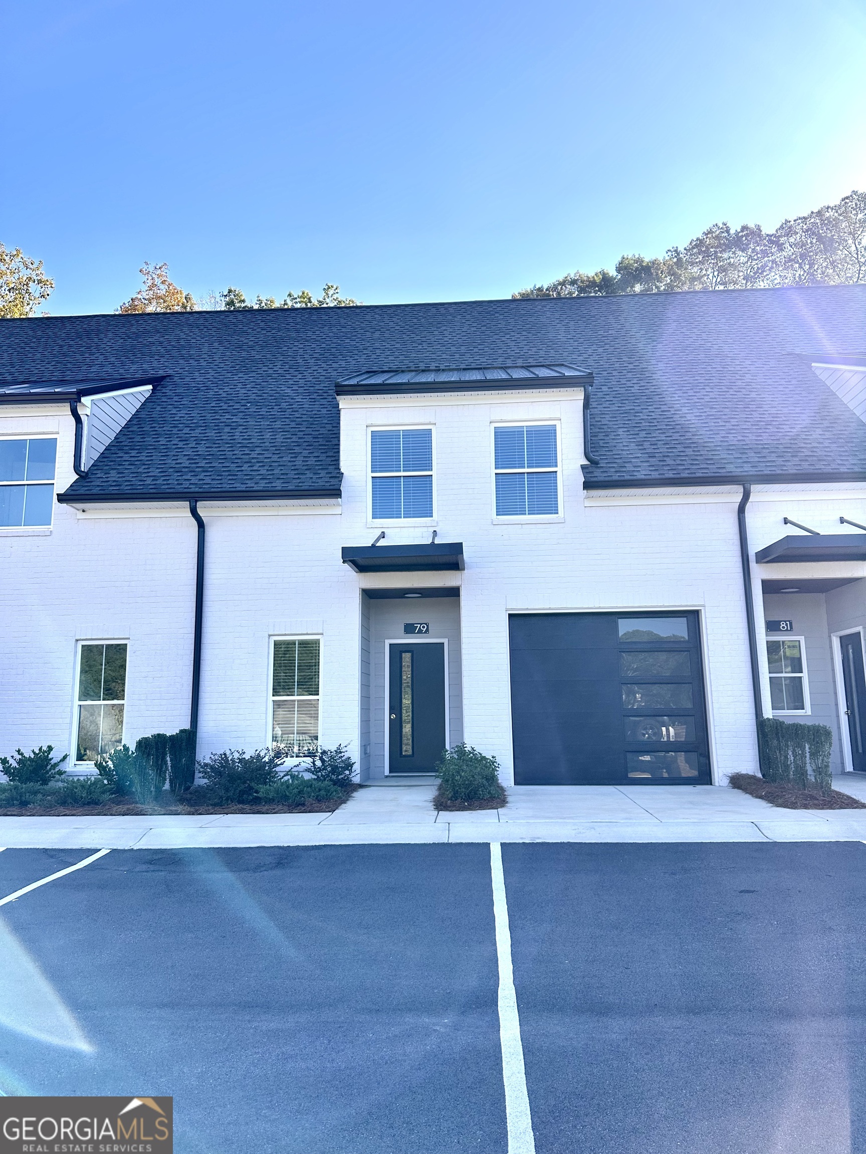 a front view of a house with a garage