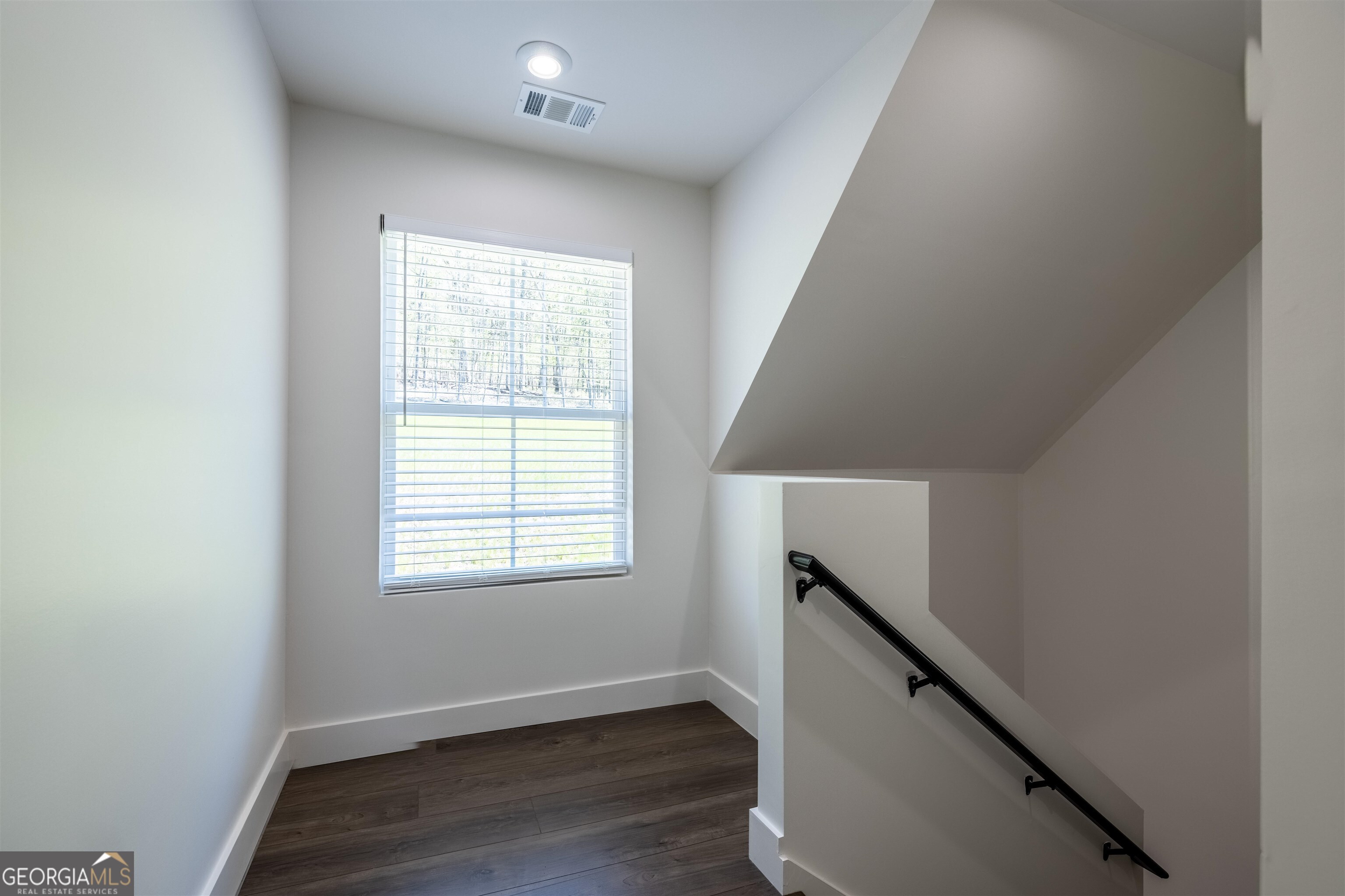 79 Chateau Drive Southeast Rome, GA 30161 - Photo 27 of 46 an empty room with wooden floor and windows