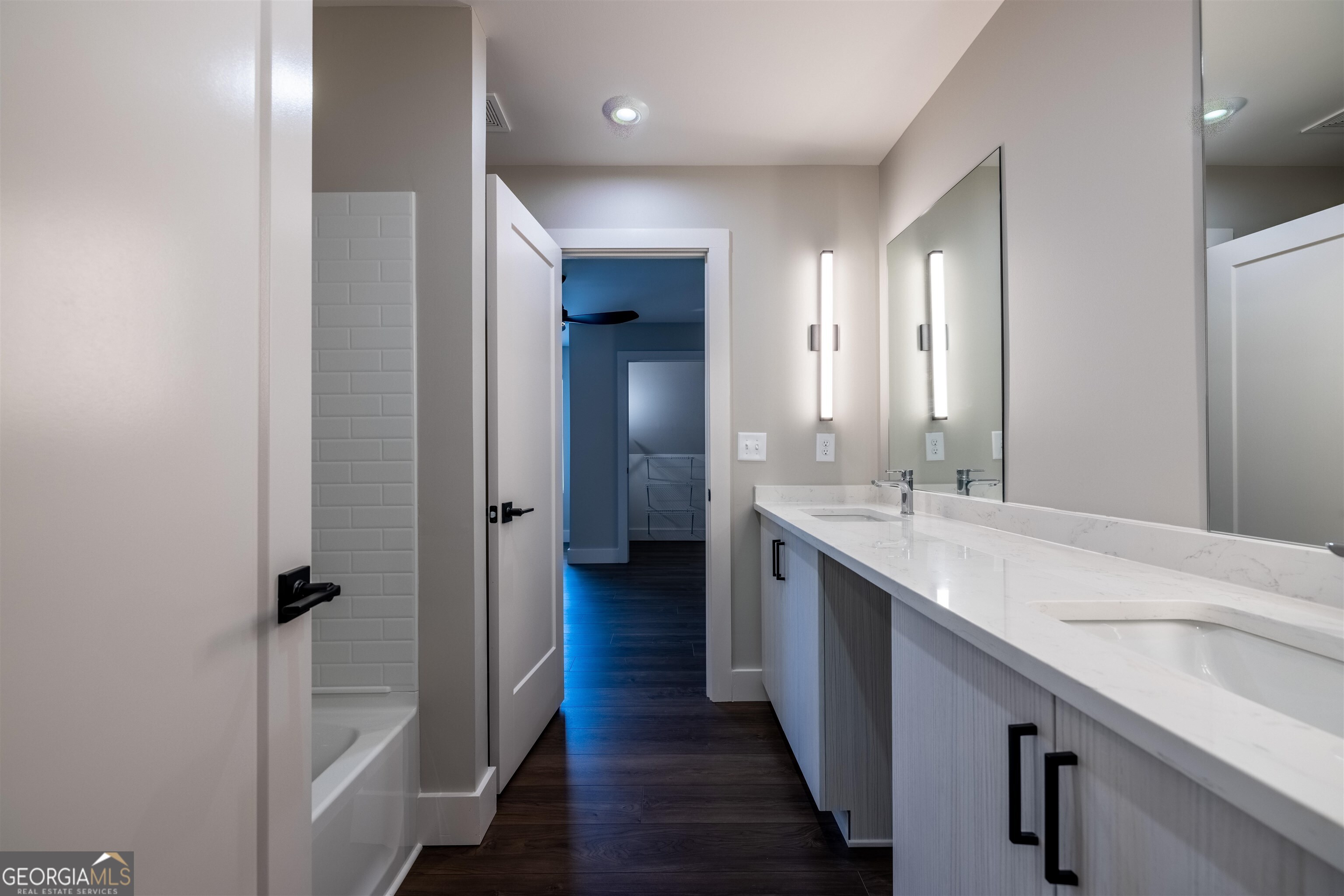 79 Chateau Drive Southeast Rome, GA 30161 - Photo 32 of 46 a bathroom with a double vanity sink and mirror