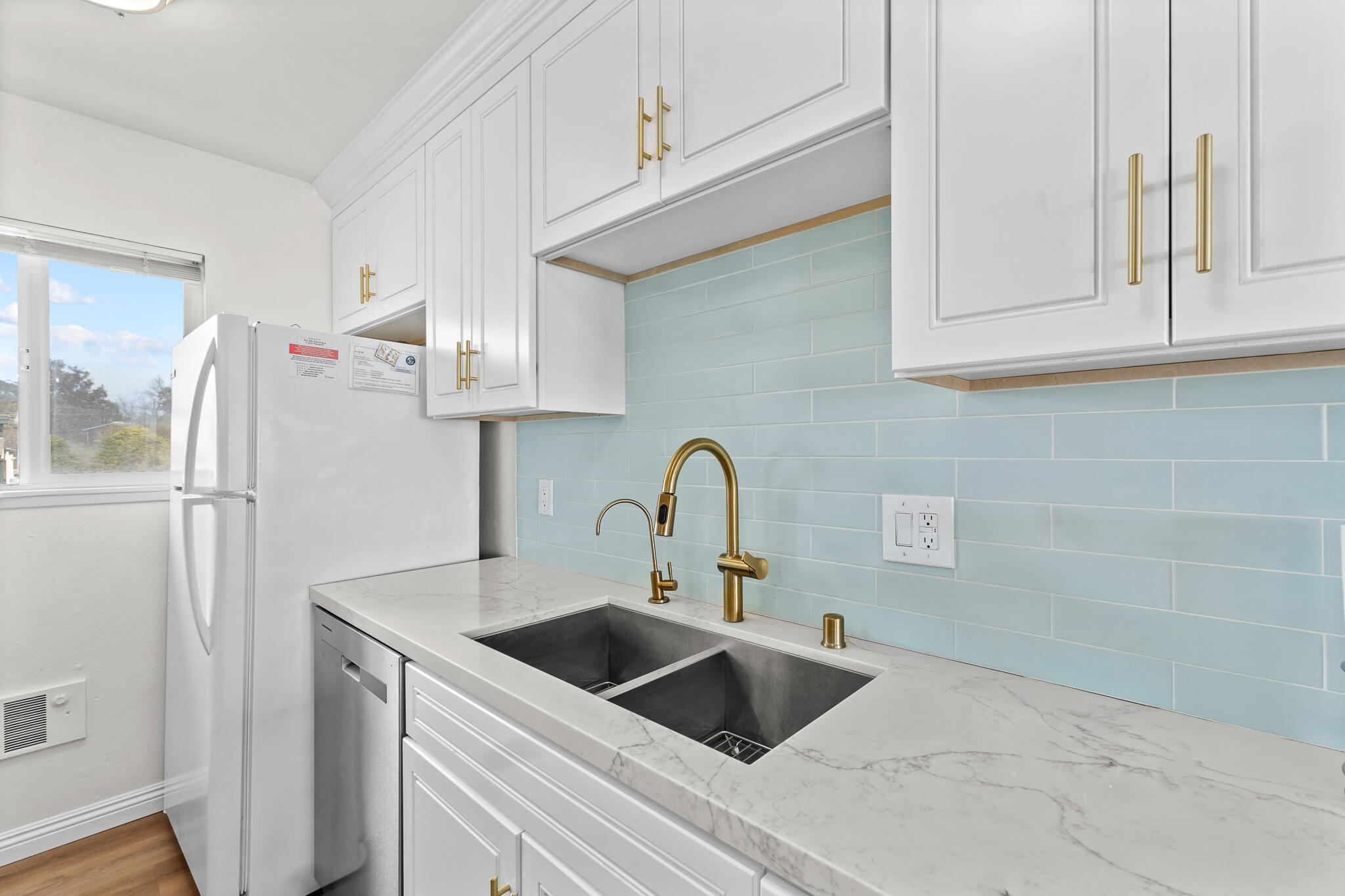 77 North Ocean Avenue, Unit 12 Cayucos, CA 93430 - Photo 12 of 41 a kitchen with stainless steel appliances granite countertop a sink and a refrigerator