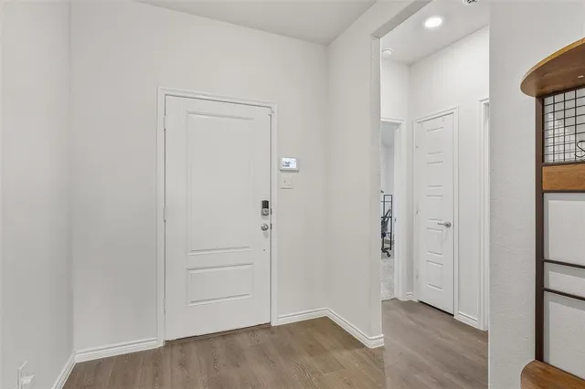 an empty room with wooden floor