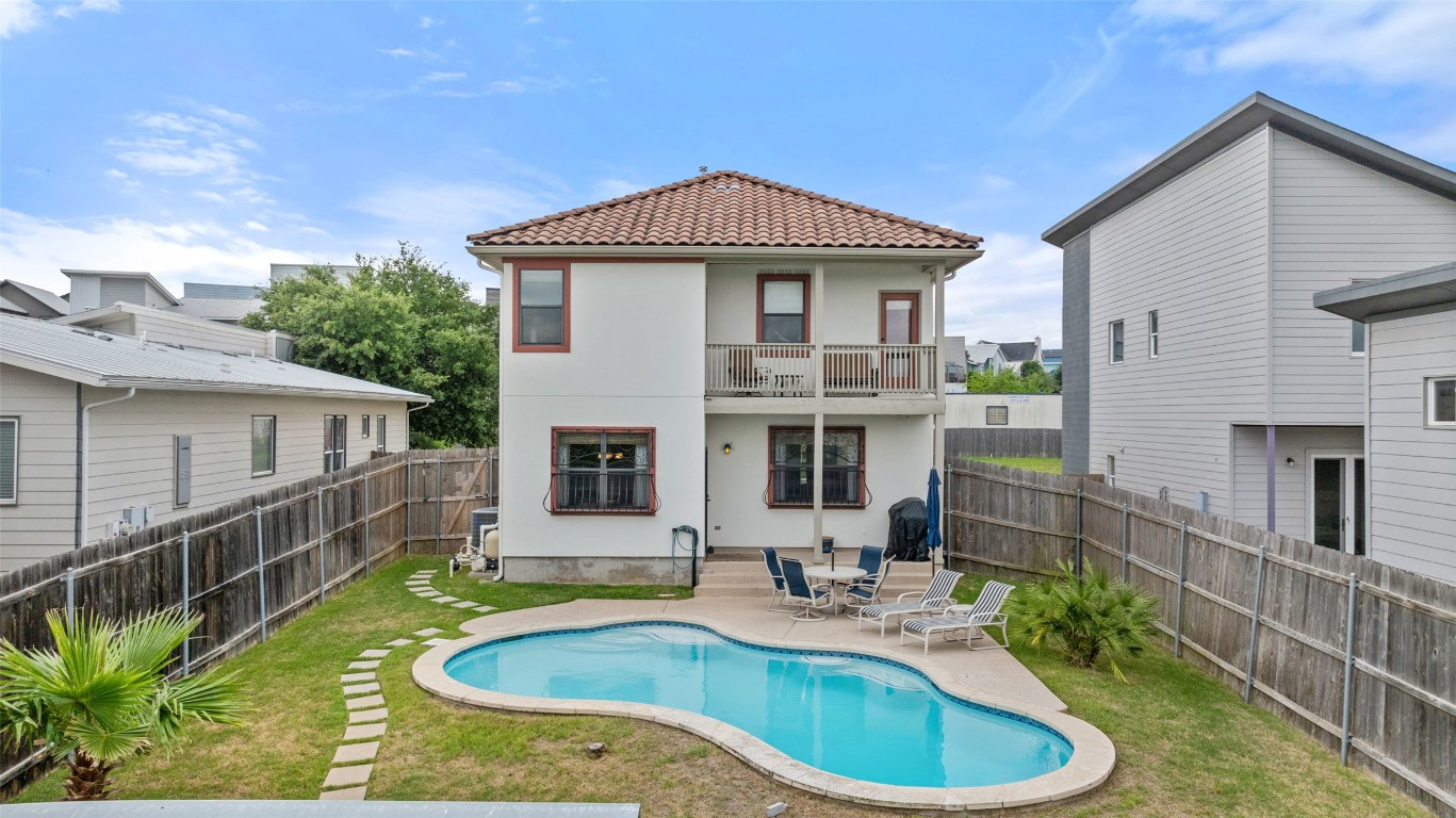 a front view of house with yard outdoor seating and barbeque oven
