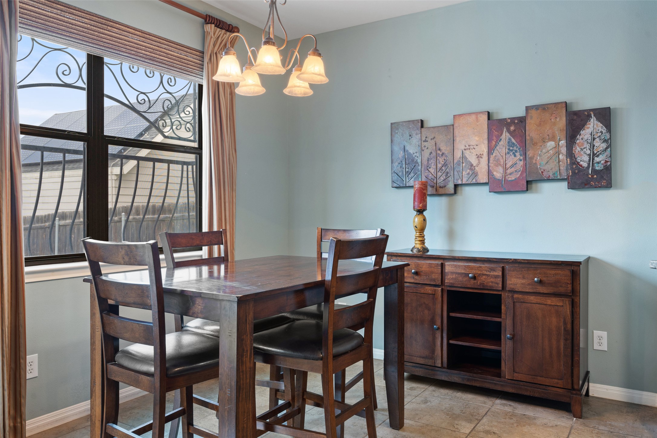 6006 Seville Drive Austin, TX 78724 - Photo 15 of 38 a view of a dining room with furniture a chandelier and a window