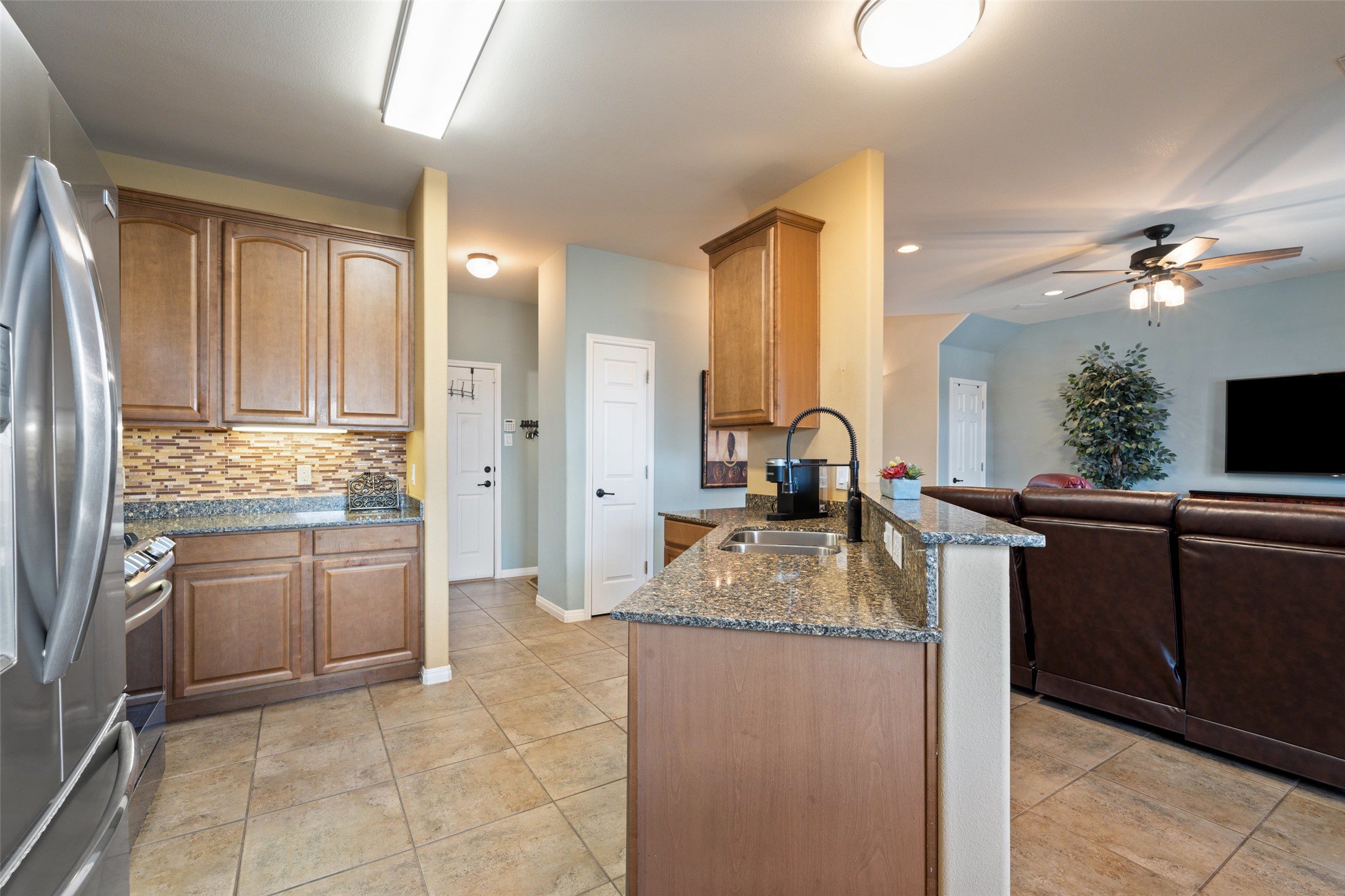 6006 Seville Drive Austin, TX 78724 - Photo 38 of 38 a kitchen with stainless steel appliances granite countertop a sink stove and refrigerator